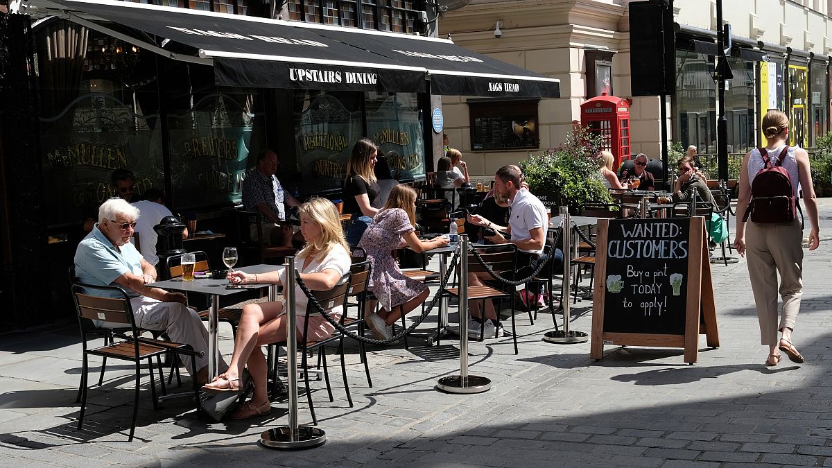 A sign outside a pub that reads: "Wanted Customers" in central London
