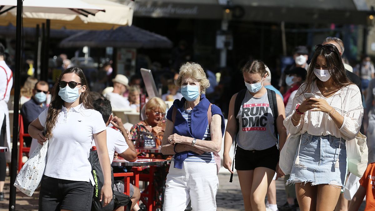 Tourists wearing masks visit Saint Malo, Brittany,