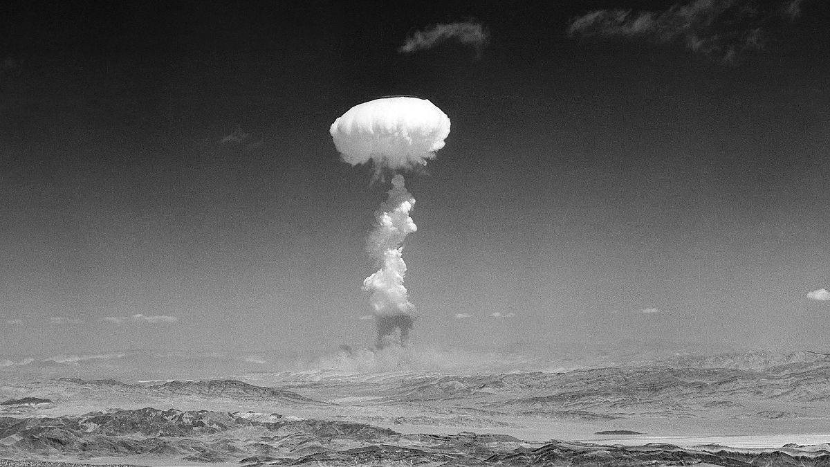 In this April 22, 1952 file photo a gigantic pillar of smoke with the familiar mushroom top climbs above Yucca Flat, Nev. during nuclear test detonation.