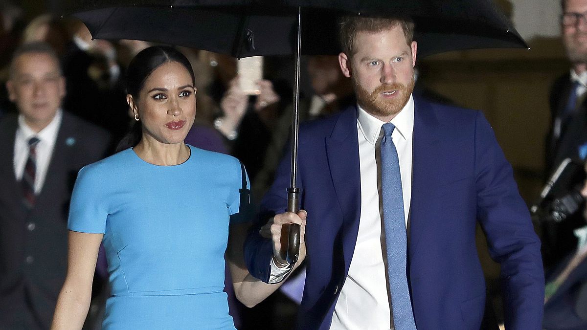 FILE - Prince Harry and Meghan, the Duke and Duchess of Sussex arrive at the annual Endeavour Fund Awards in London on March 5, 2020. 