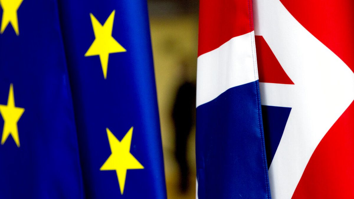 The UK flag, right, and the EU flag, left.