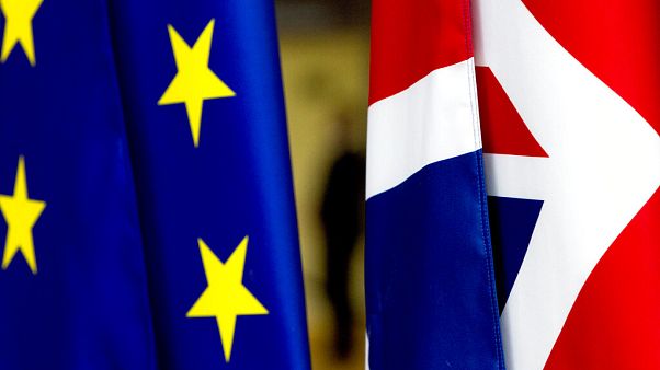The UK flag, right, and the EU flag, left. The UK flag, right, and the EU flag, left.