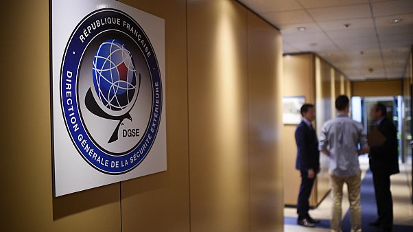 Three men speak in a corridor at the headquarters of the General Directorate for External Security (DGSE) Three men speak in a corridor at the headquarters of the General Directorate for External Security (DGSE)
