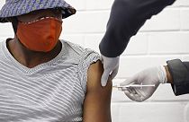 a volunteer receives a COVID-19 test vaccine injection developed at the University of Oxford in Britain, June 24, 2020