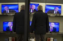 Владимир Путин на экранах телевизоров 18 декабря 2014.