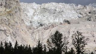 The Planpincieux glacier located in the Alps on the Grande Jorasses peak of the Mont Blanc massif, is seen from Val Ferret, near Courmayeur, northern Italy, Aug. 5, 2020.