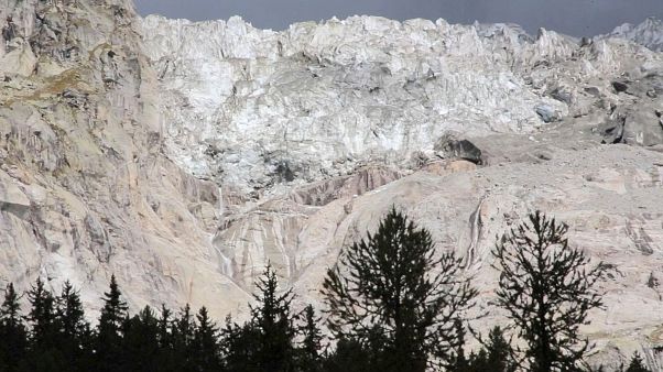 The Planpincieux glacier located in the Alps on the Grande Jorasses peak of the Mont Blanc massif, is seen from Val Ferret, near Courmayeur, northern Italy, Aug. 5, 2020. The Planpincieux glacier located in the Alps on the Grande Jorasses peak of the Mont Blanc massif, is seen from Val Ferret, near Courmayeur, northern Italy, Aug. 5, 2020.