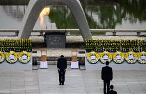 Japanese Prime Minister Shinzo Abe bows in front of the Memorial Cenotaph during the 75th anniversary memorial service