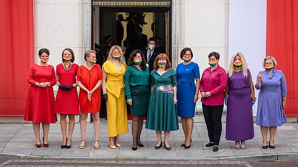 Left wing parliamentarians dressed in the colours of the rainbow pose in front of the Polish Parliament (Sejm) Left wing parliamentarians dressed in the colours of the rainbow pose in front of the Polish Parliament (Sejm)