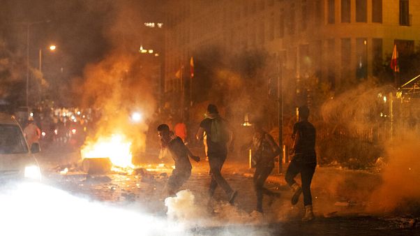 Riot police fire tear gas against anti-government protesters, during a protest against the political elites, in Beirut, Lebanon, Friday, August 7, 2020 Riot police fire tear gas against anti-government protesters, during a protest against the political elites, in Beirut, Lebanon, Friday, August 7, 2020