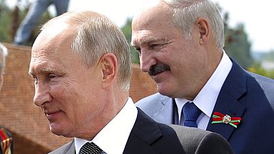 In this June 30, 2020 file photo, Russian President Vladimir Putin, left, and Belarusian President Alexander Lukashenko greet WWII veterans, in Khoroshevo,Russia 