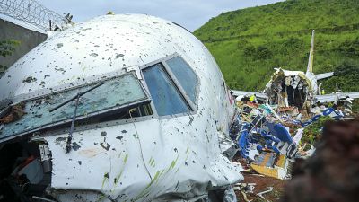 Fierce rain and winds lashed a plane carrying 190 people before it crash-landed and tore in two.