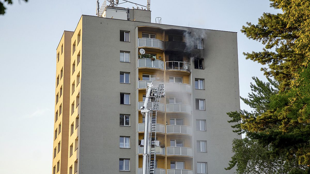 Firefighters battle a fire in an apartment building in Bohumin, northeastern Czech Republic, on Saturday, Aug. 8, 2020