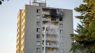 Firefighters battle a fire in an apartment building in Bohumin, northeastern Czech Republic, on Saturday, Aug. 8, 2020