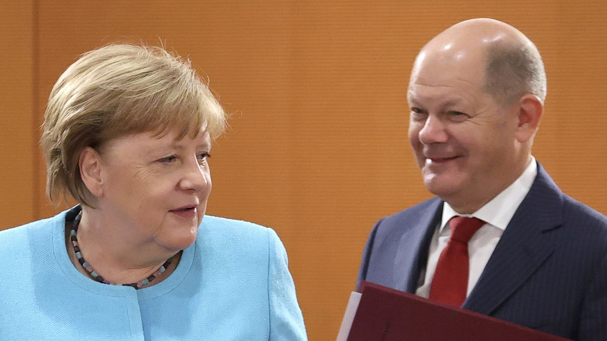 Olaf Scholz (right) has been serving as minister of finance and vice chancellor under Angela Merkel (left) since March 2018