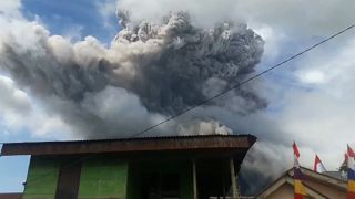 Black smoke rising from Mount Sinabung
