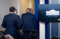 President Donald Trump is asked to leave thePress Briefing Room by a member of the U.S. Secret Service during a news conference at the White House, Monday, Aug. 10, 2020