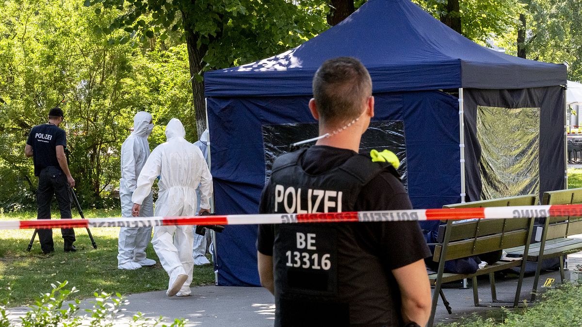This photo taken on August 23, 2019 shows police forensic experts in a Berlin park where a man of Georgian origin was shot dead. 