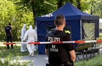 This photo taken on August 23, 2019 shows police forensic experts in a Berlin park where a man of Georgian origin was shot dead.