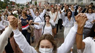 About 200 women march in solidarity with protesters injured in the latest rallies against the results of the presidential election in Minsk, Wednesday, August 12, 2020..