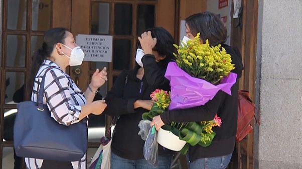 Women outside a funeral home where the body of Benoît Maria was brought Women outside a funeral home where the body of Benoît Maria was brought