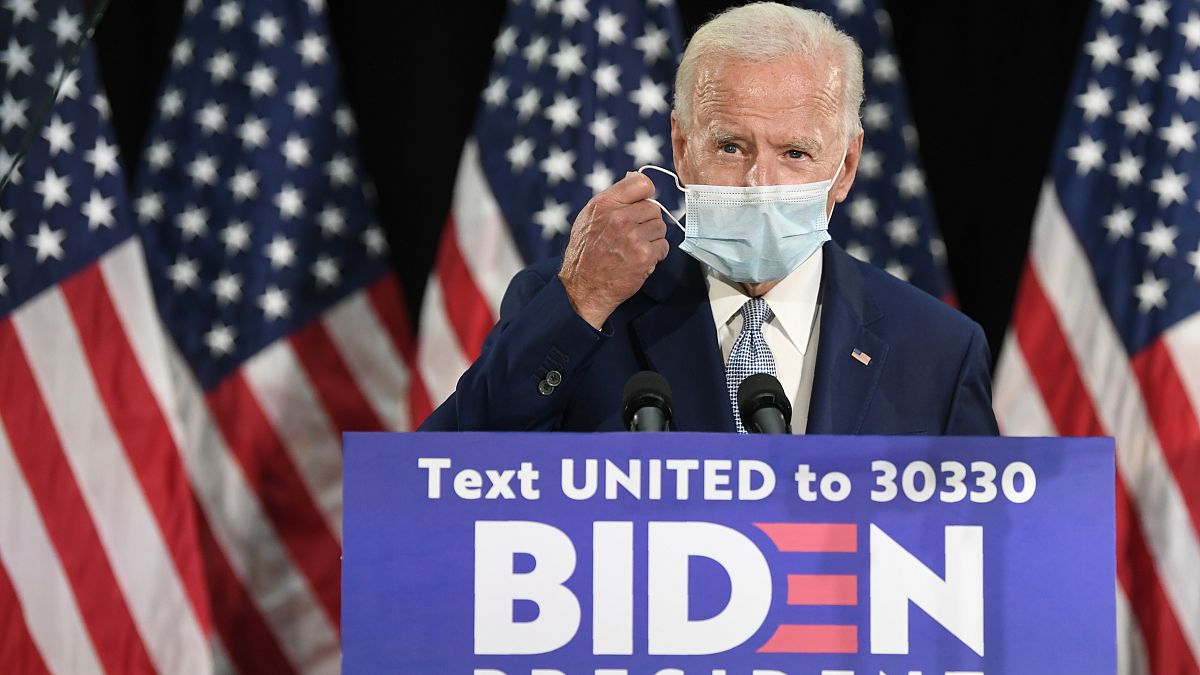 Democratic presidential candidate, former Vice President Joe Biden takes off his mask