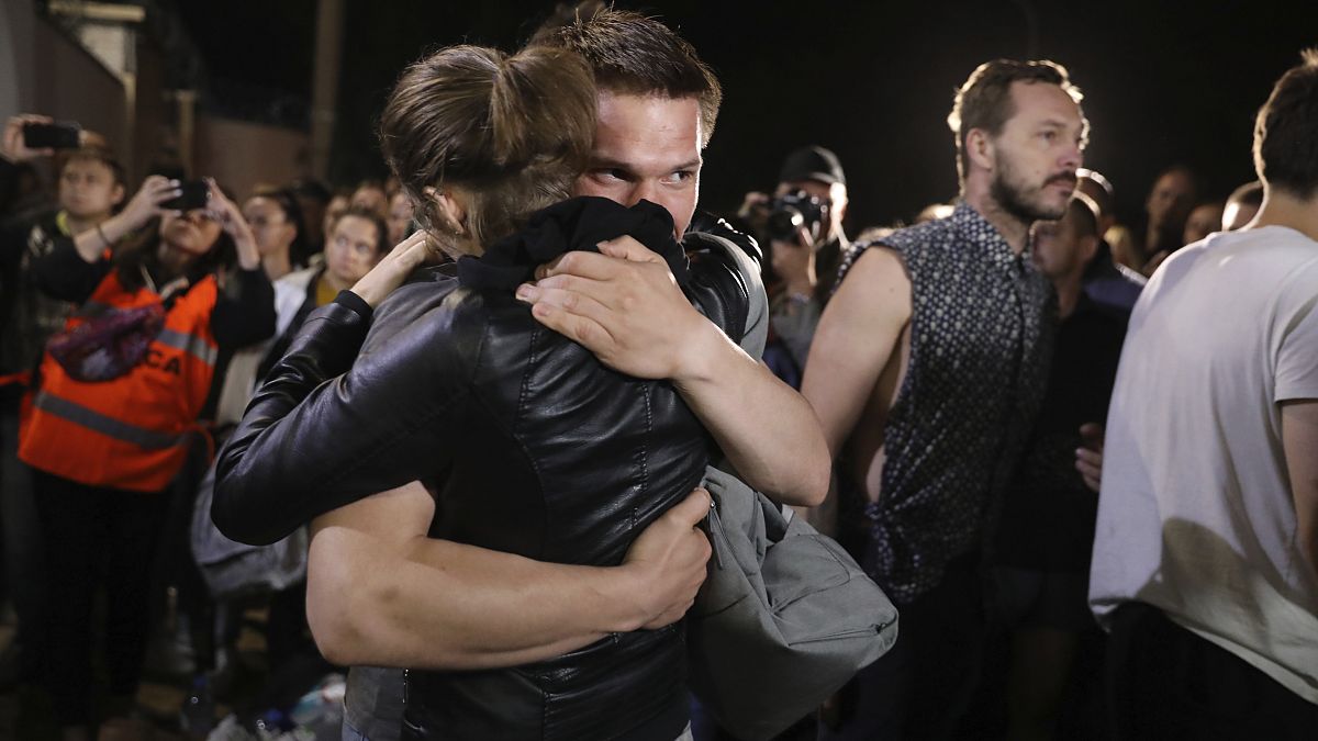 A couple hug after being released from a detention centre where protesters were detained during a mass rally following the presidential election in Minsk, Belarus. August 14