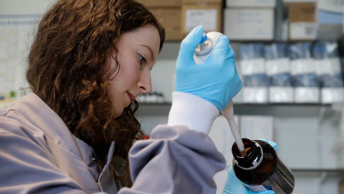 Jess O'Hara a research technician works on the process of testing antibodies to see if they bind to the virus, in the laboratory at Imperial College in London, July 30, 2020 