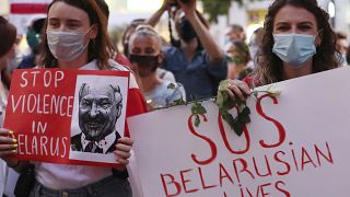 People demonstrate in support of Belarusians after a troubled weekend presidential vote, in Warsaw, Poland, Thursday, Aug. 13, 2020