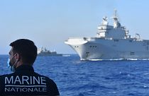 French Tonnerre helicopter carrier escorted by Greek and French military vessels during a maritime exercise in the Eastern Mediterranean.