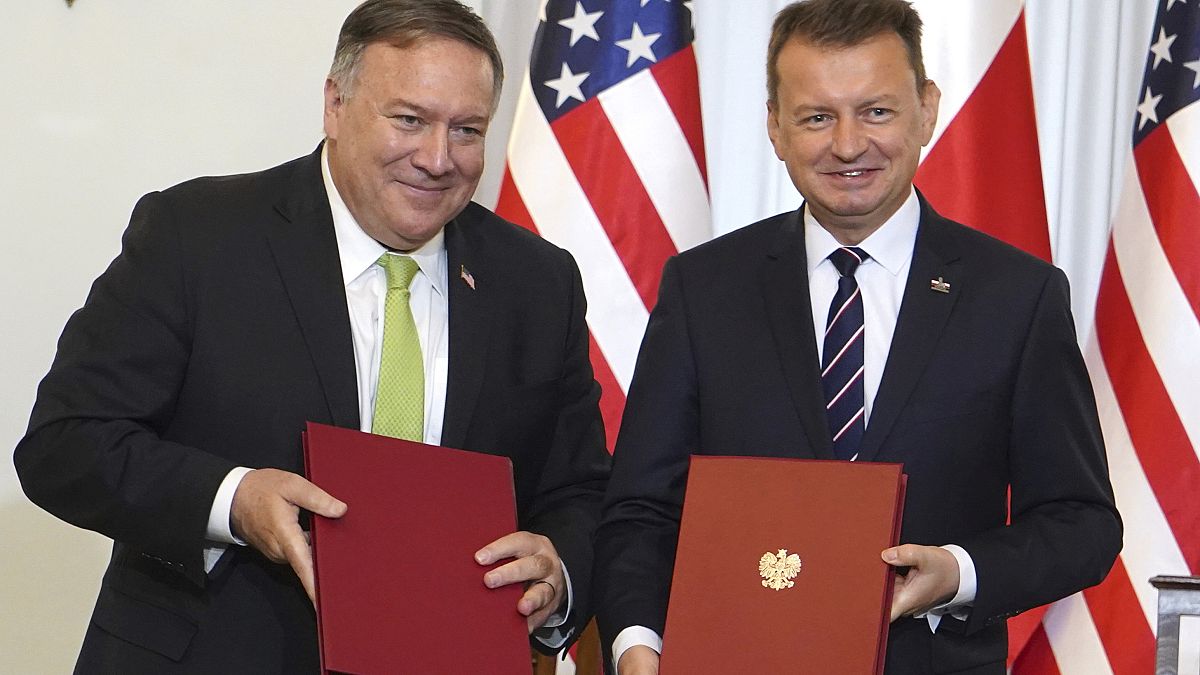 US Secretary of State Mike Pompeo, left, and Poland's Minister of Defence Mariusz Blaszczak after signing a defence cooperation deal.