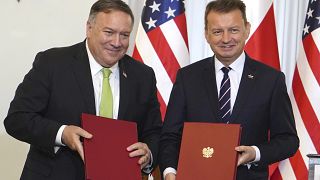 US Secretary of State Mike Pompeo, left, and Poland's Minister of Defence Mariusz Blaszczak after signing a defence cooperation deal.