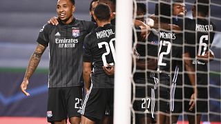 Lyon players celebrate after their third goal during the Champions League quarterfinal match