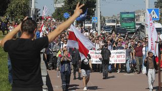 Workers march toward the Minsk Wheel Tractor Plant where President Alexander Lukashenko addresses employees in Minsk, Belarus, August 17, 2020