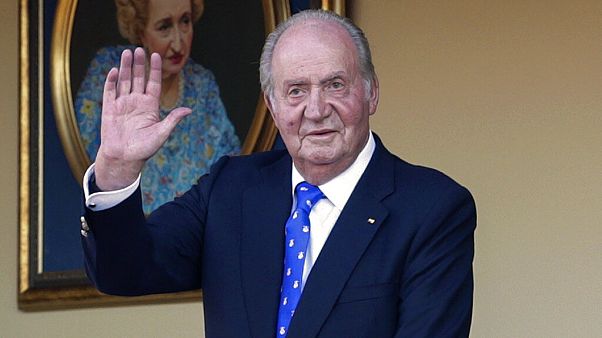 In this Sunday, June 2, 2019 file photo, Spain's former King Juan Carlos waves during a bullfight at the bullring in Aranjuez, Madrid, Spain In this Sunday, June 2, 2019 file photo, Spain's former King Juan Carlos waves during a bullfight at the bullring in Aranjuez, Madrid, Spain