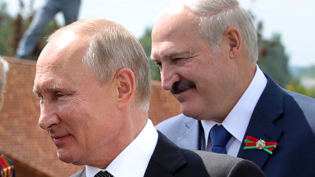 In this June 30, 2020, file photo, Russian President Vladimir Putin, left, and Belarusian President Alexander Lukashenko greet World War II veterans.