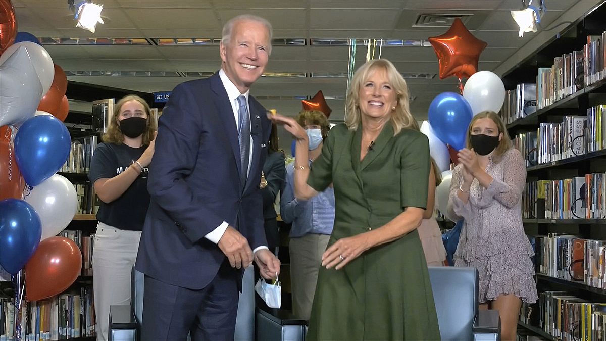 In this image from video, Democratic presidential candidate former Vice President Joe Biden, his wife Jill Biden, celebrate after the roll call vote at the DNC. 