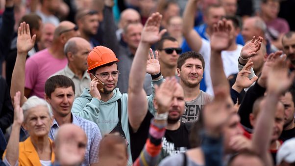 Protesters and police are seen in front of the Minsk Tractor Works Plant in Belarus. August 19, 2020