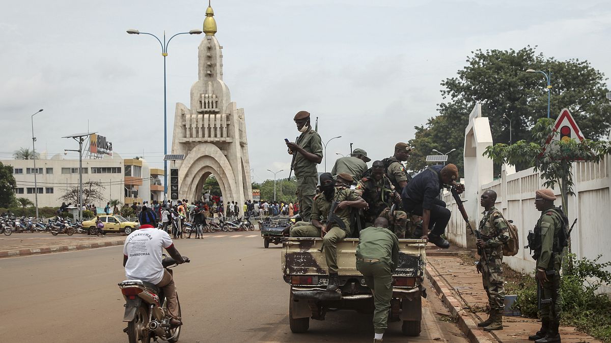 Security forces were pictured riding on trucks through the capital city, Bamako, on Tuesday.