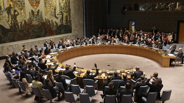 In this July 20, 2015, file photo, members of the Security Council vote at United Nations headquarters on the landmark nuclear deal between Iran and six world powers. In this July 20, 2015, file photo, members of the Security Council vote at United Nations headquarters on the landmark nuclear deal between Iran and six world powers.
