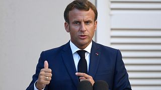 French President Emmanuel Macron speaks to the media during a press conference with German Chancellor Angela Merkel at the Fort de Bregancon, south France, on  Aug. 20, 202