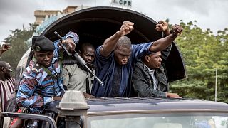 Security forces and others in celebration drive through the streets of the capital Bamako, Mali, Wednesday, Aug. 19, 2020