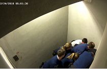 Police officers subdue Slovak man, Jozef Chovanec in this image taken from CCTV inside a cell at Charleroi airport in Belgium on Feb. 24, 2018.