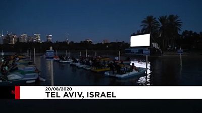 Moviegoers on boats in Tel Aviv's Hayarkon Park, Israel, August 20, 2020.
