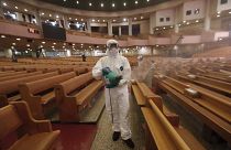 A public official disinfects as a precaution against the coronavirus at the Yoido Full Gospel Church in Seoul, South Korea, Friday, Aug. 21, 2020