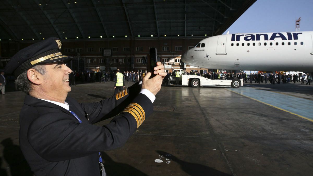  Iran Air pilot Mehdi Jafarzadeh takes a picture of the arrival of his company's new Airbus plane at Mehrabad airport, in Tehran, Iran