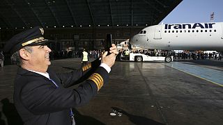  Iran Air pilot Mehdi Jafarzadeh takes a picture of the arrival of his company's new Airbus plane at Mehrabad airport, in Tehran, Iran