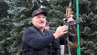 Video provided by state TV shows Belarus President Alexander Lukashenko armed with a Kalashnikov-type rifle on Sunday.