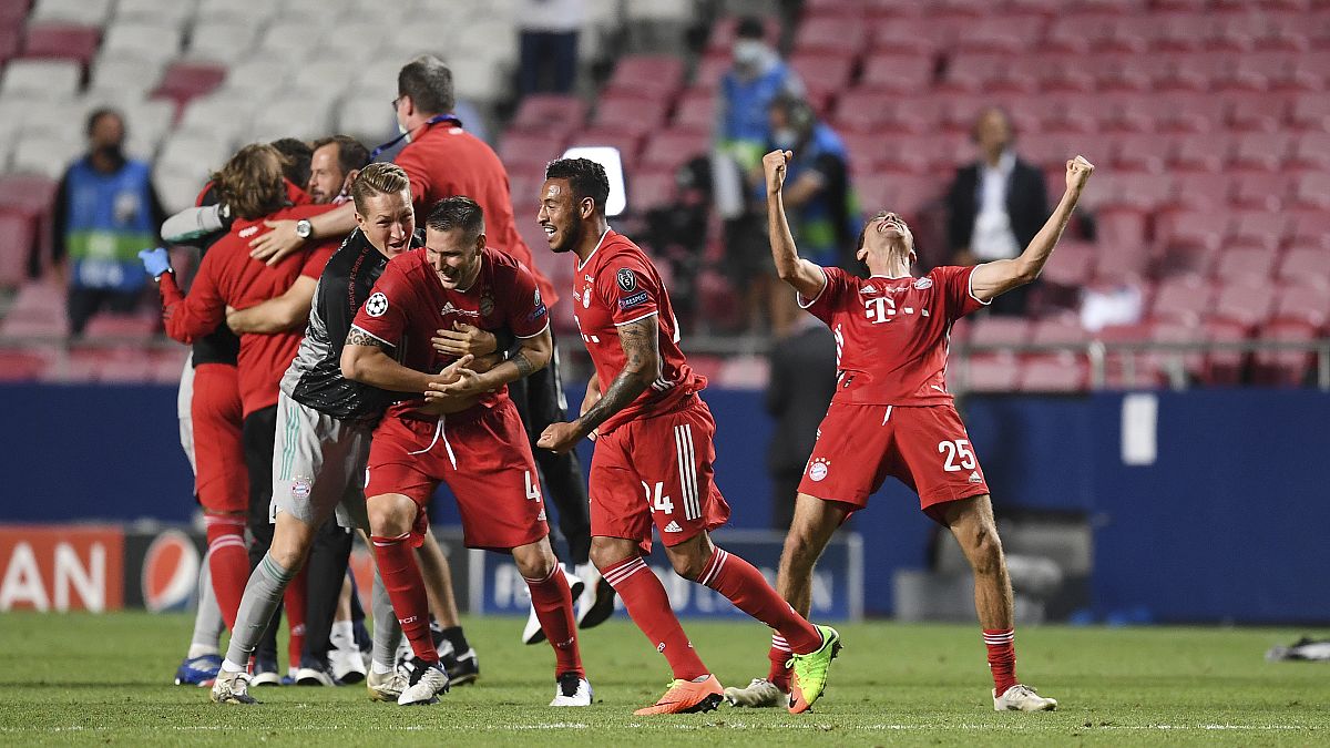 Bayern's Thomas Mueller, right, celebrates after winning the Champions League final soccer match between Paris Saint-Germain and Bayern Munich.