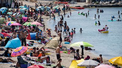 A packed beach at the beginning of a July heatwave in Marseille. The French health ministry has warned that COVID-19 transmission is increasing amid the summer holiday season.